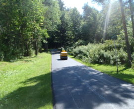 single worker on machine on the road