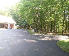 open garage with new pavement in front of it
