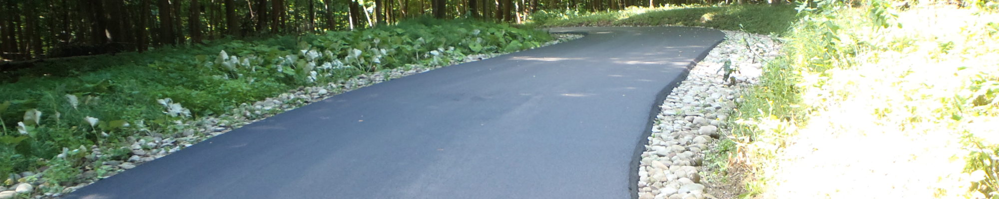 winding road with new pavement on it