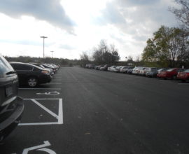 cars on pavement with sky up top