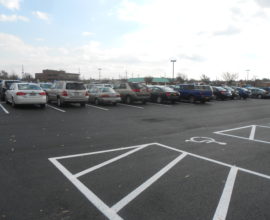 open sky with large parking lot with new pavement