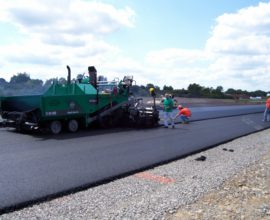 smoothing machine placed on top of pavement