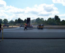new pavement being placed by workers