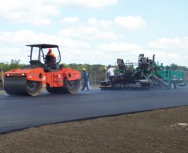 group of workers paving the road