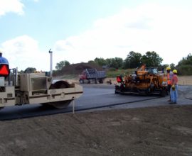 road workers paving the smooth pavement