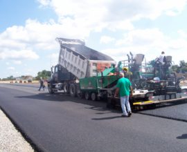 workers going over pavement