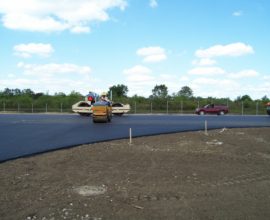 dirt patch with pavement on top of it