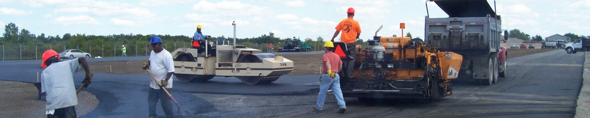 several workers smoothing concrete