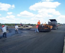 several workers smoothing concrete