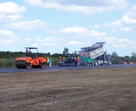 blurred photo of workers from across the road