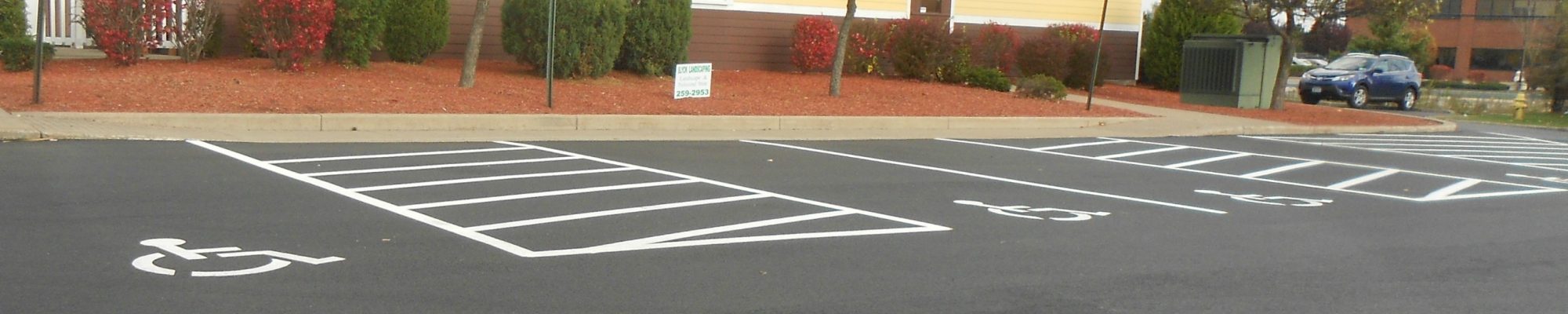 new pavement on top of a parking lot