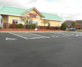 new pavement on top of a parking lot